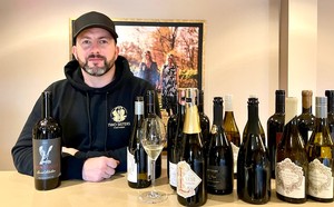 Adam with 202 red wines