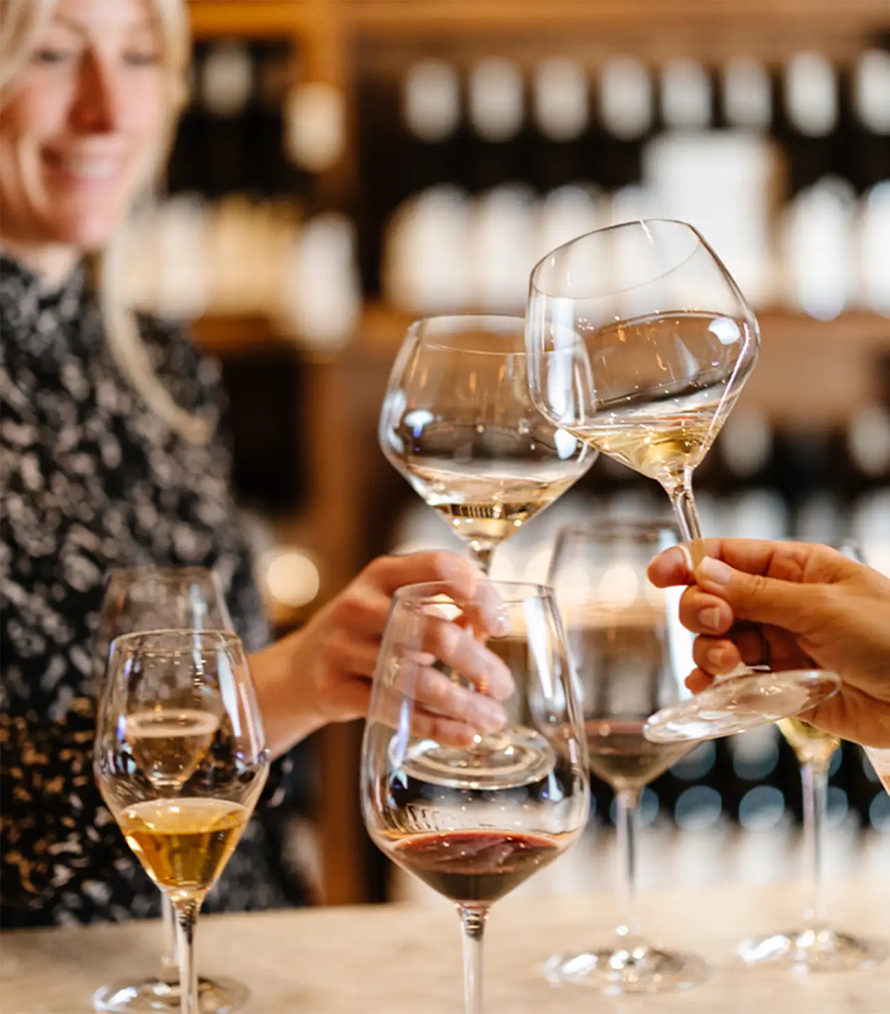 Two people enjoying Two Sisters Vineyards wines.