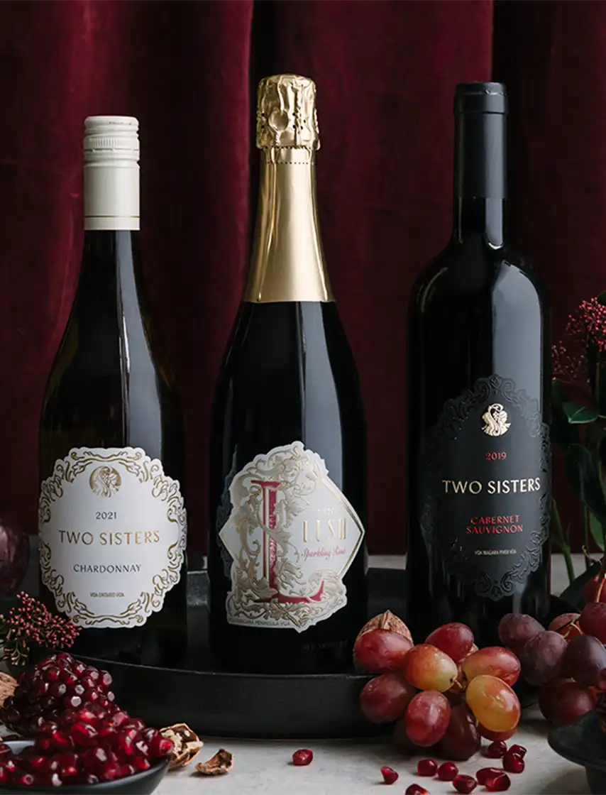 Two Sisters Vineyards Wine bottles lined up.