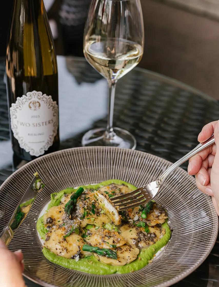 Fresh pasta and green sauce, and a glass of white wine.